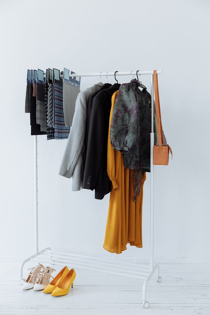 A clothing rack showcasing diverse apparel, including jackets and skirts, perfect for fashion inspiration.